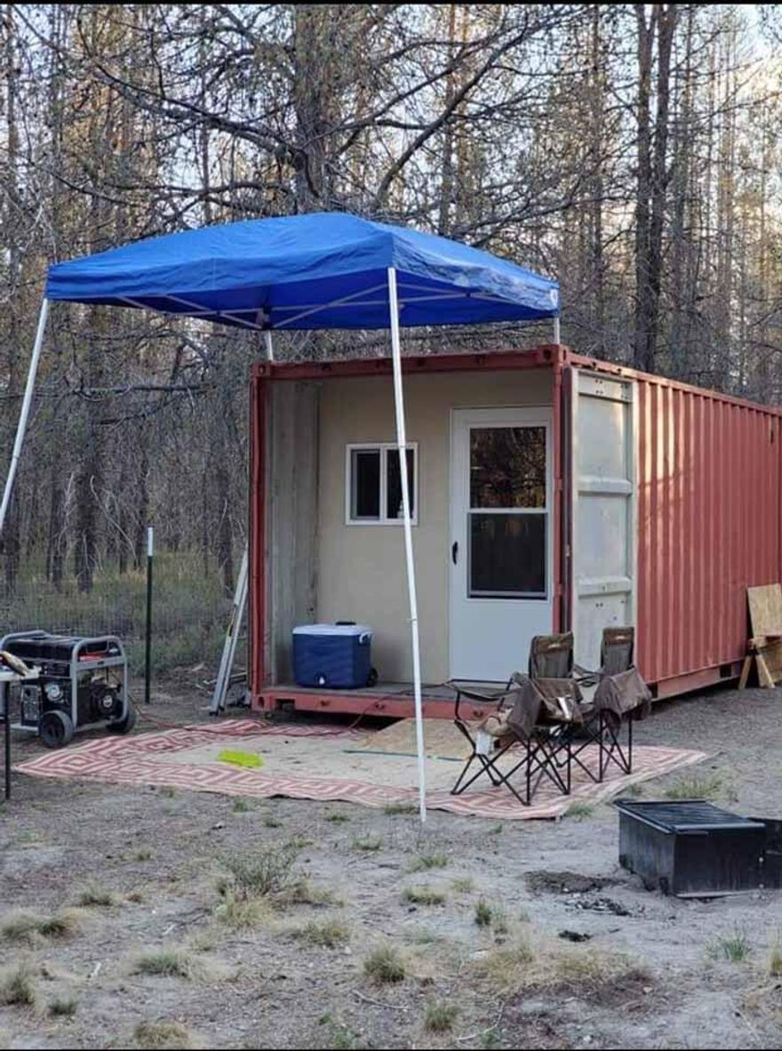 1.01 Acres, fenced, and has a customized container that doubles as a living quarters for camping. The living quarters have a second set of doors just inside the main entrance. This is well thought out and planned. Nice treed parcel with excellent road access. Power and phone are right at the road edge of the property.
This is priced right and worth checking out.
Wonderful area and there is unlimited recreation in the area. Skiing, fishing, boating, with this place you can enjoy every season throuout the year.
GPS 42.9170  -121.8282