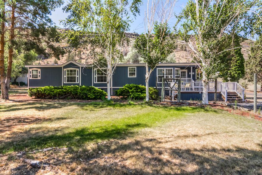 Nearly four acres in Crooked River Ranch with canyon views located a short drive from the Crooked River Ranch Golf Course, restaurants, the post office, groceries, gas and more. This 1782 square foot home has new exterior paint, new laminate flooring throughout the living area, kitchen and master bathroom.  The roof on the house and detached garage/shop are both new.  There is fresh paint in the living area, kitchen and all of the bedrooms.  The stainless steel appliances in the kitchen are two years old.  The master bathroom also has fresh new paint plus dual sinks and an additional vanity.  There is also a walk-in shower and plenty of room for a soaking or jetted tub.  The covered back deck is a great place to enjoy a morning cup of coffee or a nice summer evening.  The bunkhouse off the back deck has a sink and toilet and could make a great office, studio, kids play house or guest quarters. This home is heated and cooled by a heat pump plus there is a wood stove in the living room.