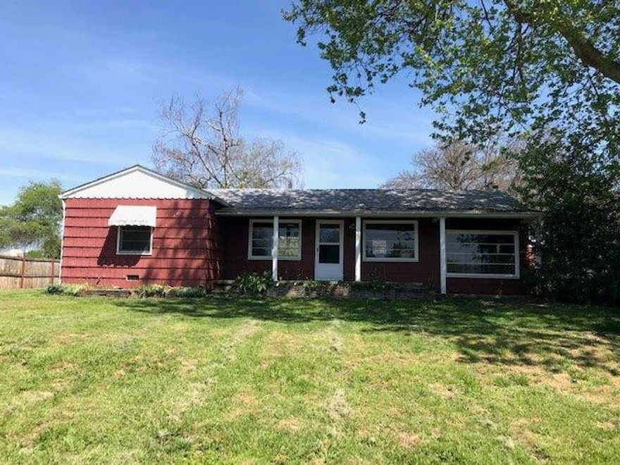 Don't let the road fool you! Outstanding potential with this country style home that sits to the rear of the property. Covered front porch, covered rear patio, fruit trees, 2 car detached garage with small shop. The home has some hardwood floors, a wonderful cabinet covered kitchen with down lighting. Nice addition of a big master bedroom and bathroom. Most of the property is fenced. This is a true diamond in the rough. Priced to sell.