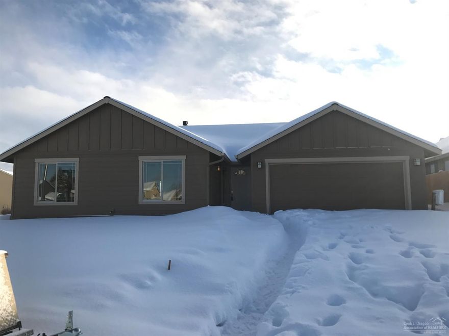 New construction in SW Redmond's Julina Park. 3 bed,2 bath in excess of 1561 sq.ft. of living area. Large Great Room opens to Dining and Kitchen with eating bar. Knotty Alder cabinets with tile counter tops, all stainless appliances. 30 year roof, forced air gas that is AC Ready. Separate utility room. Double car attached garage. fully fenced, landscaped front and back with sprinklers. Single level home with great curb appeal.