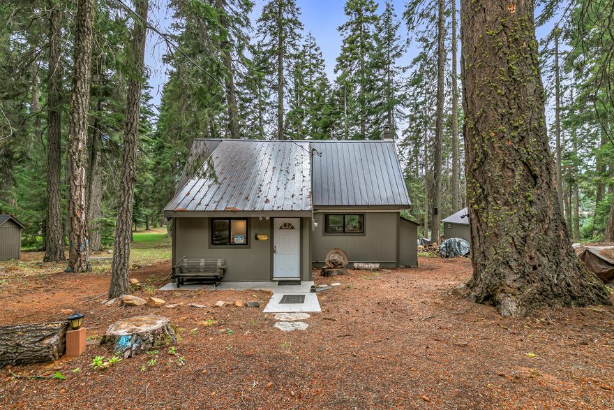 Discover the perfect getaway with this charming 3-Bedroom, 1 1/2 bath cabin nestled along the peaceful shores of Hyatt Lake. Surrounded by tall pines and crisp mountain air, this classic cabin offers a
cozy retreat with plenty of room for family and friends. Inside, you'll find a warm and inviting living space with rustic wood finishes, an open kitchen, and plenty of natural light. The upstairs adds extra sleeping space or a perfect hideaway for kids. Outside, a large Trex deck with brand-new railings provides the perfect spot for entertaining, relaxing, or simply soaking in the lake views. Step down to your own slice of lake frontage-ideal for launching a kayak, casting a line, or sipping your morning coffee in peace. If you want a year-round escape, this cabin blends comfort, character, and an unbeatable setting. Property is on leased land from Bureau of Land Management.