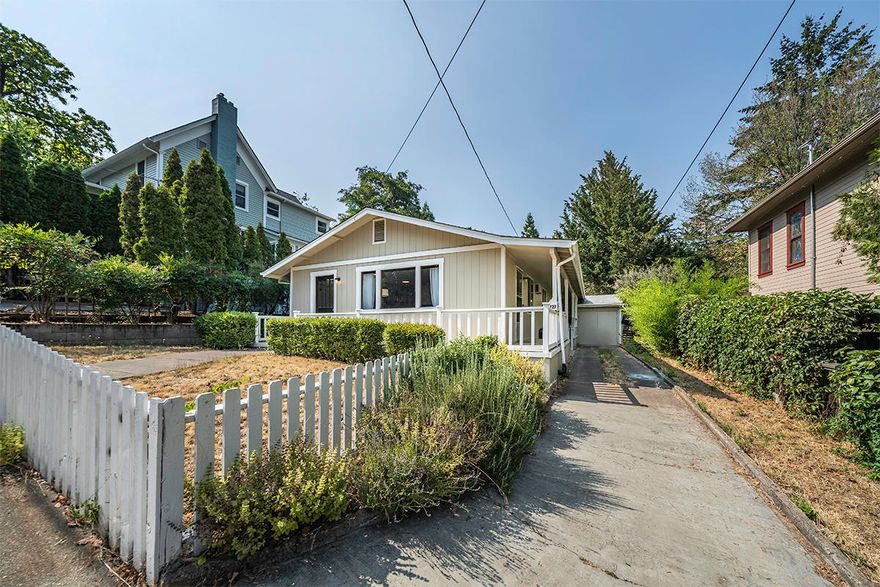 Darling single level home on spacious lot, just 3 blocks from the Ashland Plaza and Lithia Park! Recent upgrades include new ductless mini-splits, fresh interior and exterior paint, modern lighting, blinds, and newer roof. Open concept living and dining room features built-in display cabinetry and views of the Oregon Shakespeare Festival. Efficient kitchen layout with stainless sink and electric range oven. Light and bright master with ceiling fan and full closet. One full bathroom with shower and vanity cabinets. Second bedroom opens to a large poured concrete back patio with adjacent storage area and laundry. Outside is a large wrap-around porch, private off-street driveway parking, and second detached storage shed towards the back of the property. Inquire with agents for renderings of a proposed 902 square foot ADU with garage, and 828 square foot addition to main home.