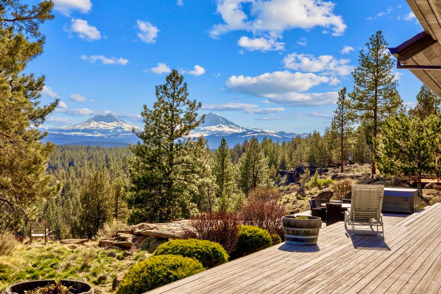 HUGE Cascade Mountain, canyon & creek views from this high-quality, custom designed & built single-level home. Interior features: Open floor plan; Two en suites with great separation & direct access to back decks; Extra high ceilings; Extensive run of skylights in great room; Large windows/doors providing abundance of natural light; Clear cedar ceilings in high areas; Custom Mahogany cabinetry & built-ins; Eucalyptus flooring; Granite countertops; Large gourmet/kitchen with stainless appliances, huge island, built in wine cooler/bottle storage; Large primary bedroom with great windows/high ceiling/fireplace/walk-in tile shower/closets/double vanity/jetted tub; 8' Douglas Fir doors & wood framed windows. Exterior features: Large covered front & back porch; 3 car garage with extra width/depth; Full attic storage; Additional 2 car garage/shop; Large paved driveway; RV parking with complete sewer, power, water hookups; Copper front door & gutters; Recirculating Hot Water; Canyon access.