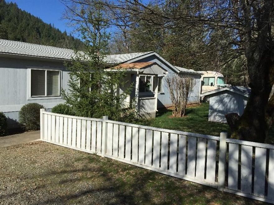 Beautiful rural property only minutes from town and only feet from a year round Murphy Creek. The home itself is a sprawling 1904 sq/ft and 4 bedrooms with a bonus room off the master suite. 3 of the bedrooms have brand new carpet. Also, separate living and family rooms and large dining room and an island in the kitchen. There is a storage building near the front of the property (previously used for storing canned goods), another shop with many various uses and another large shop with a small bonus room that is nearly finished off. Good sized fenced yard offers plenty of room for a garden, covered deck, RV Parking, and the west property line backs up to BLM. Lots to see here.