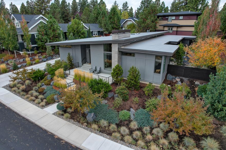 This single-level, custom home features an open floor plan with windows that bring the outside in while preserving your privacy in Northwest Crossing. The house sits on a premium lot looking out to green space across Lolo. An enormous kitchen open to the dining room boasts a 6'x6' island, custom cabinets with plentiful storage, and high-end JennAir appliances. The wide plank French white oak wood flooring is gorgeous. Vaulted ceilings keep it light and bright. The heated tile floor and no step shower complement abundant cabinet storage in the Primary bath and walk-in closet. Entertain on the covered patio in most any weather, or relax by the fire pit. Open the door to the enclosed bonus patio off the kitchen to fire up your BBQ or let your doggie run free on the turf. 3 car garage provides room for the Bend necessities and is also a no step entry to the home. With wide hallways and great sight lines, this house lives large in the middle of all that Bend offers.