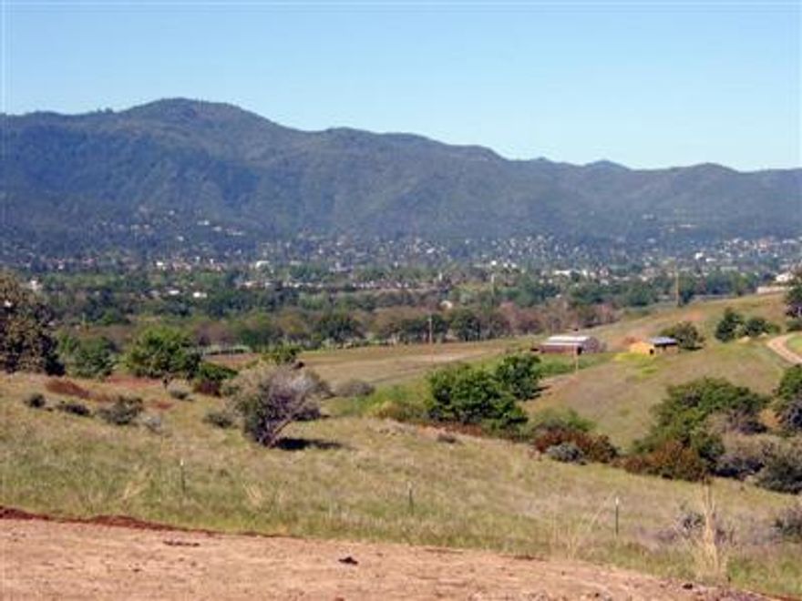 5.35 acres just 3 miles from downtown! Surrounded by amazing panoramic views of Grizzly Peak, Klamath Summit, Pilot Rock, Mt Ashland, Pompadour Rock and the Rogue Valley. Home-site ready! Standard septic approved. Utilities pulled. Fenced. Year-round creek. Talent Irrigation Dist. Neighboring vineyard. Close to Ashland airport. Great schools. SOU, Acclaimed health-care. Lithia Park. Shakespeare Festival, arts, great food and shopping. Emigrant Lake. Ski Mt Ashland. Sunshine!