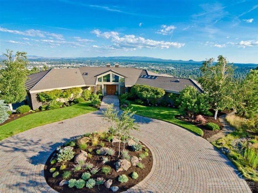 Awe inspiring home w/ 180 degree views from the eastern buttes to Mt. Bachelor to the twinkling city lights below. Framed through fireplace is a view of the Deschutes River flowing downtown. The discerning buyer will appreciate the authentic architecture of this special home, fusing design with its surroundings, & perfectly situated on almost an acre lot. Tastefully appointed, the ease & flow of the floor plan lends itself well to indoor/outdoor entertaining & comfortable family living. A rare opportunity!