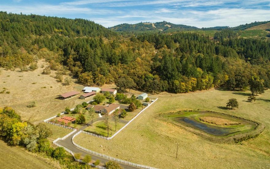 OUTSTANDING 147 acre ranch with remodeled 1915 Farmhouse AND additional adjacent 5.16 acre parcel with residence. Nestled into the scenic foothills of Historic Brownsville. Diverse topography with Merchantable Timber create the backdrop for pastoral setting and year round grazing. Perimeter fenced and cross fenced for easy rotation management. Year round pond and seasonal creek with waterfall provide natural livestock hydration. Excellent feeder barns, 40x60 shop, machine sheds and covered working pens. Owners raised cattle, but property and outbuildings easily adaptable for other livestock options. Imagine relaxing in the pergola covered hot tub and entertaining on paver patio with built-in barbecue. With $600K in upgrades since 2012, owners have turned this diamond in the rough into a beautiful place to live, work and play. ADDITIONAL 5 ACRE adjacent parcel with 2014 Palm Harbor double wide manufactured home included with this listing. Take in the beautiful valley view as y