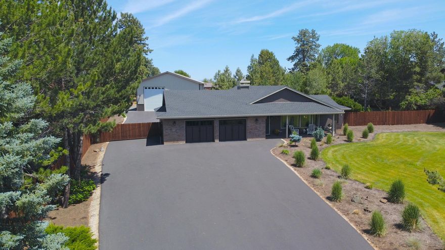 Incredible opportunity to own acreage property in one of the most desirable neighborhoods in Bend. A custom built, single level home that has been completely remodeled and re-imagined. All of the character from it's original design but lives like a new build. Spacious and open living with tasteful finishes throughout. Enjoy a warm and inviting entrance through the garage and into an oversized mudroom. A separate, private office space allows for a great opportunity to work from home. New, built-in storage in master closets. A fenced in Hot Tub area and paver patio with pergola for BBQ and drinks in the Summer shade. Brand new garage doors on main home. A separate, 1,500 sf garage/shop - fully insulated, with upgraded heaters throughout and RV pull through. Fully rigged setup with 200 amp plug-ins, 50 amp welder plug and RV hook-up, this is the ultimate flex space. A fully fenced back yard. Full size, professional grade Pickleball court with fencing and much more!