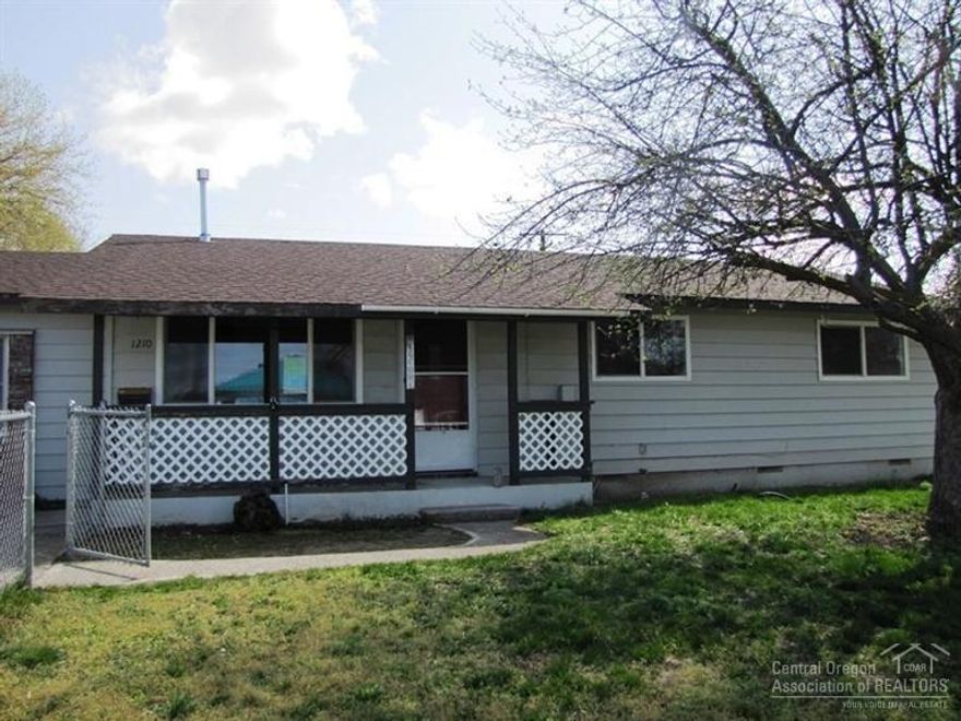 Lots of potential in this cute, single-level home on a corner lot! Features 4 bedrooms and 2 baths, wood floors, living room, dining area, and spacious kitchen with new appliances and breakfast bar. New interior paint and carpeting. Situated on a good sized lot with large drive through gate in backyard to access 864 sf shop w/roll up door. Mature apple tree in the front yard. Don't miss this one! This is a Fannie Mae Homepath property.