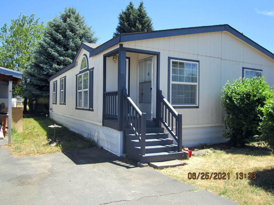 Manufactured  home in family park offers corner lot.   Ready for new owners.  Open floor plan with great room with vaulted ceiling open to the dining area leading to the kitchen  with writing desk.  All kitchen appliances remain with the home, as well as the washer & dryer.  Enclosed carport leads to the back door , patio, 8' x 10' storage shed.  Space rent is $360.00 monthly.  Includes street lighting, snow removal and garbage.  Owner pays water and sewer.  Park approval will be needed.  View this home now, will not be on market for long.