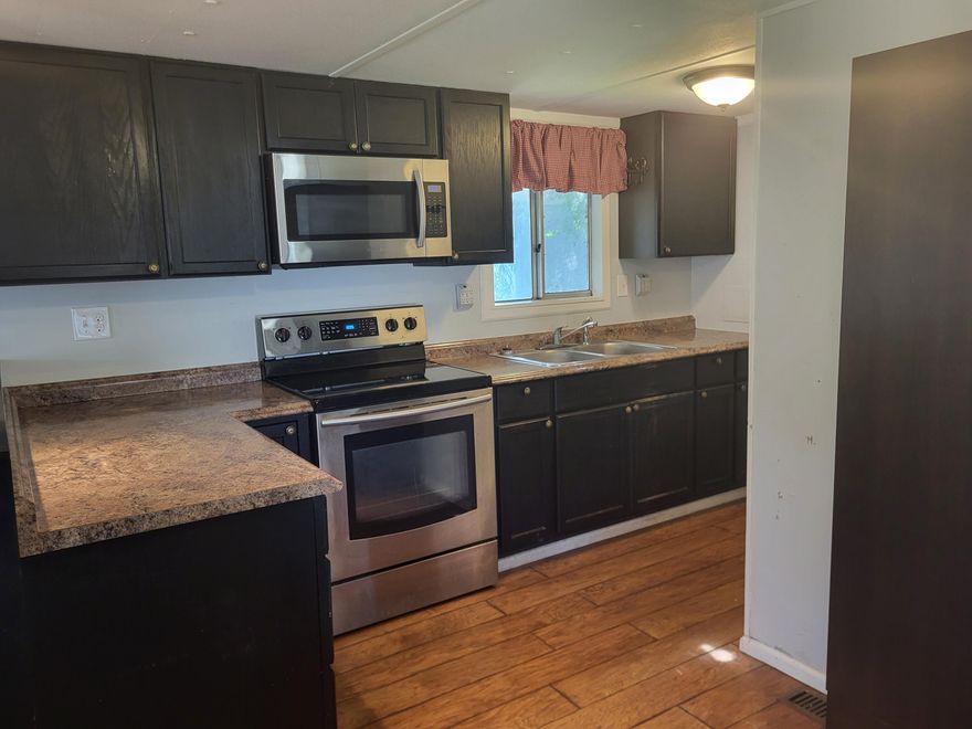 All-age park with rural surrounding.  1bd, 1ba, remodeled and includes newer stainless kitchen appliances, washer, dryer, laminate flooring, extra-large, end-of-road lot with extra parking, multiple sheds and large shop with enclosed storage.  There is also a walled off grassy area for pets or a sun-filled garden!!  Easy access to I-5, and boarders Gold Hill.