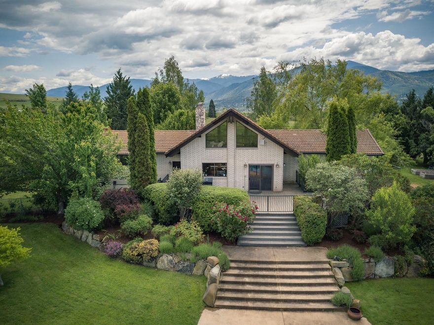 The perfect rural property, located close to town. Situated in a private, gated, pastoral setting, with beautiful Mt. Ashland and City light views! The 9.3 TID irrigated acres crosses over Myer Creek. The beautiful grounds include decks, patio, an in-ground, salt water pool; and a self-contained guest house; ideal for entertaining, overnight guests or gatherings; plus a hot tub, sauna & organic garden. The main home has one-level living with lovely views and a spacious Master Suite opening to a private balcony. The luxurious bathroom has been remodeled with travertine tile and a large soaking tub. The kitchen opens to a great room with vaulted ceilings, a fireplace and hardwood floors. Plus, there is a self-contained in-law, or guest apartment down. There are two barns and a covered arena including tack rooms, bathrooms, and an office. The property is fenced and cross-fenced. Plus, horse boarding income can gross $48,600 per year!