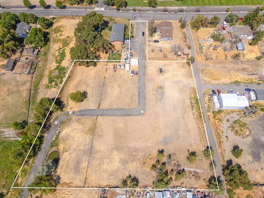 Prime Development Opportunity - 2.5 Acres Zoned R1. This is a rare opportunity to acquire 2.5 acres of flat, build-ready land in an exceptional location—directly across from the Jefferson County Fairgrounds. Zoned R1, this property has the potential to be subdivided into as many as 20 single family lots (buyer to verify with the City of Madras). Sewer has already been installed throughout the property, offering a major head start for development. Whether you're looking to build a subdivision of single-family or multi-family homes—or explore other possibilities. RV park potential exists, given the property's proximity to the fairgrounds & ideal layout for accommodating seasonal activity. This is an investment worth serious consideration. Please consult with the City of Madras for specific zoning and use requirements. Two conceptual Subdivision plans exist, ask for copies to review different development approaches. Growing demand and location offering direct access to everything!