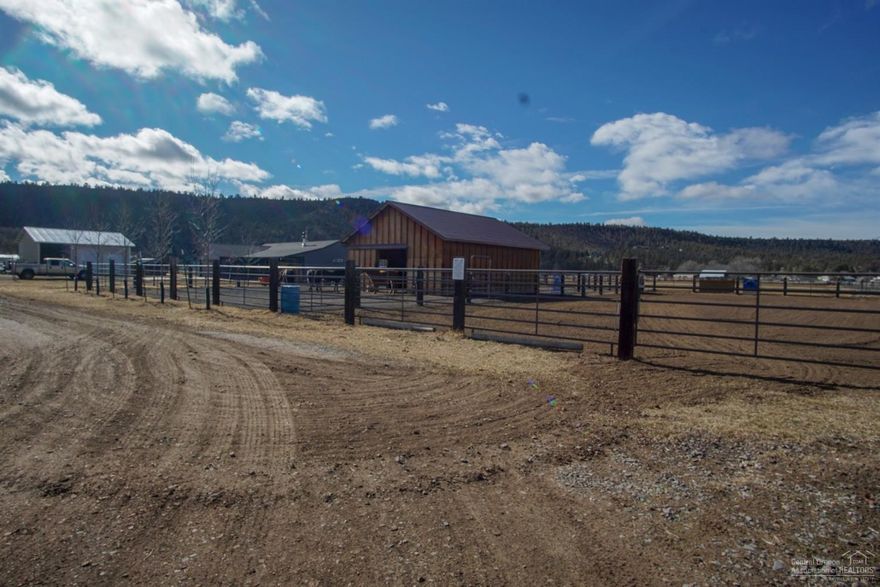 Well set up horse property on 9.8 acres with 8 acres of irrigation. Home has a nice layout with vaulted ceilings, split floor plan, and large fenced back yard with lots of trees for shade in the summer. Outside you will find a barn and corral area, multiple cross fencing options, a stud barn with two separate runs, arena area, shop with concrete floors and an RV bay, 2 chicken barns (12x16 and 16x16). These are two tax lots, each has its own well and power so you could divide. Flood irrigation is set up for easy irrigation.