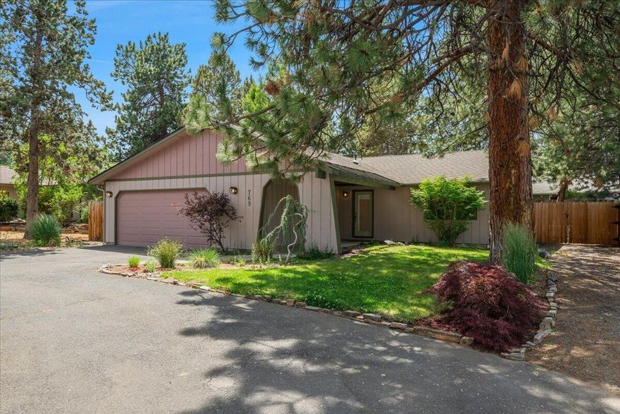 This light-filled single-level ranch in SE Bend's Larkspur neighborhood sits on a private .22-acre lot at the end of a quiet cul-de-sac. With 1,751 sq ft (including a 231 sq ft permitted addition in 2023), the home now features expanded living and dining areas—ideal for entertaining and everyday comfort.  Enjoy vaulted ceilings, hardwood floors, four skylights, and generous natural light throughout. Recent updates include a newer roof, fresh interior paint, and brand-new carpet, making this home truly move-in ready.  The oversized 2-car garage, circular driveway, and dedicated RV parking offer convenience and flexibility. The fully fenced back yard is perfect for outdoor living, complete with mature pines and a built-in fire pit.  Located minutes from the Larkspur Center, parks, and trail systems, this home blends comfort, functionality, and location in one of Bend's most beloved neighborhoods.