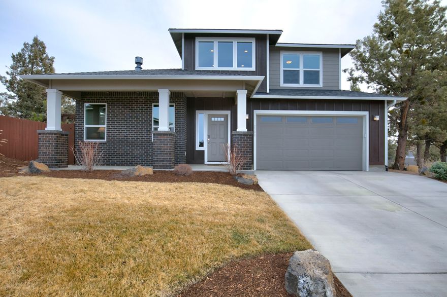Impeccably maintained, two-story craftsman style home on a quiet cul-de-sac in NE Bend with stunning views of the Cascade Mountains and Pilot Butte. Light and bright open floor plan with brick gas fireplace. This home exudes quality and functionality throughout. Enjoy entertaining friends in the gourmet kitchen complete with quartz countertops, stainless steel appliances and large walk-in pantry. Spacious primary suite on main level with large walk-in closet, double vanity and walk-in tile shower. Upstairs are two generous sized guest bedrooms with shared bathroom and a bonus room. After a long day of work or play, sit back and relax around the fire pit in your private, fully-fenced, beautifully landscaped backyard. Separate laundry/mud room. Two car garage with extra space to store all of your extra outdoor gear. Front seat views of the 4th of July fireworks on Pilot Butte is the ultimate bonus!