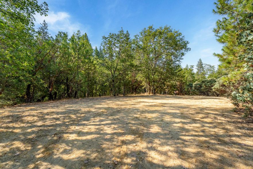 Beautiful 2.87 Acre Lot - Ready to Build + Peaceful Country Living Just Minutes from Town. Escape to the perfect blend of privacy and convenience with this pretty + private 2.87 acre parcel located just outside of town. Nestled among mature, beautiful trees, this serene piece of land offers the ideal setting for your dream home or weekend getaway. The property is fully equipped and ready to build on, featuring: a nice producing well, power on site, septic, and an outdoor restroom for upmost convenience! Just bring your plans!! Level, usable land with plenty of space for a house, shop, garden, or more. Property also borders BLM land for endless exploring, hiking and more. Whether you're looking to build now or invest for the future, this property offers unbeatable value and potential. Don't miss this rare opportunity - schedule a visit today and envision the possibilities!