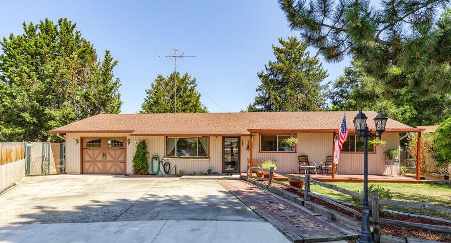 Lovingly maintained single level ranch home located at the end of the cul-de-sac with mature landscaping & plenty of off-street parking.  Warm and inviting with laminate flooring, wainscoting and dining area off kitchen with slider to covered back deck.  Kitchen remodeled 3-4 years ago with wood cabinets, mid-century gas range/oven, walk-in pantry, tile counters and tile floor.  Recently updated baths with new toilets, new vanities and new vinyl.  Good sized primary room with ½ bath.  New roof and gas HVAC 3-4 years ago, newer hot water heater, new gutters, new concrete driveway approach, privacy fencing, garden sheds, garden area and oversized single garage with opener.  Conveniently located close to schools & shopping.