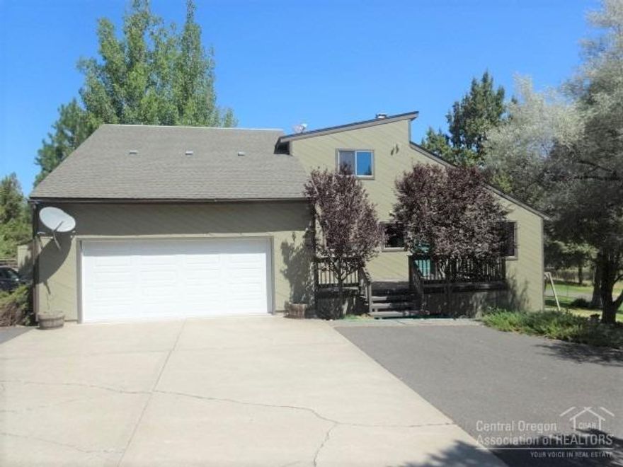 Peaceful setting on 4.88 acres with lovely views across Antelope Creek to surrounding hills.Private,park-like yard near Prineville Reservoir recreational area, adjacent to BLM land, yet just off Juniper Canyon Road. Mature trees and lush lawn surround this spacious tri-level home.1152 sf Main story living has 2 sided rock fireplace, 2 story living room, dining with deck access, breakfast bar in tile kitchen,slab oak cabinets, utility, 1/2 bath and open stairway to 480 sf Upper level with 3 bedrooms & 2 baths. 3rd bedroom is open to hall and was used as a den, 1152 sf walk-out Basement with 2nd living/ sleeping area, office/rough plumbed kitchen, bath and storage. Attached 624 sf garage + 896 sf attached, heated shop with 220 service, Double carport/storage building, tack room, barn. Gated, paved circular driveway to home, garage,shop and all out buildings. Trex decking, cedar diagonal siding,new carpet, fresh interior paint.Electric FA furnace + 3 cadets for vacation heat.