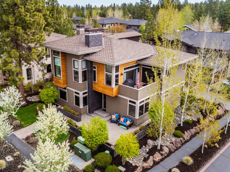 Beautifully appointed custom and modern home in Three Pines. You will enjoy looking out onto the mountains and private views from this thoughtfully and lovingly designed reverse living home. It features an expansive and open floorplan with everything a family is looking for. Large chef's kitchen, with a ton of natural light, large island bar for entertaining and open to the living and dining rooms all featuring expansive views of the trees, open space, mountains, etc. The master bedroom is loaded with his and her walk-in closets, soaking tub, large walk in shower and views. Downstairs has a nice living/bonus room with 2 bedrooms, a full bathroom, utility/laundry room and access to the garage. An office is also part of this thoughtfully designed home. Just steps away from the Shevlin Park trails and all of the westside amenities, this home is the perfect blend of retreat, home, fun, convenient, neighborly and private!