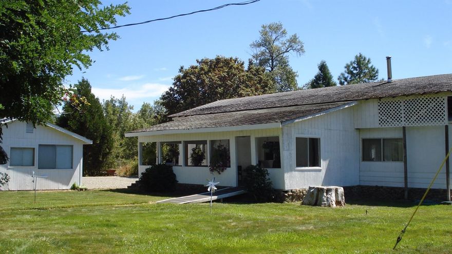 Gorgeous views of the surrounding mountains from this level 8.16 irrigated acres. Zoned EFU with 1943 water rights. Fenced & cross-fenced pasture areas. 3 bedroom, 2 bath, 1344 sqft, 1974 manufactured home with a ramada roof. Large front covered deck to enjoy the views and summer evenings. Detached oversized 2 car garage with a workshop, barn, extra hobby/craft room, and ample RV parking with hook-ups.