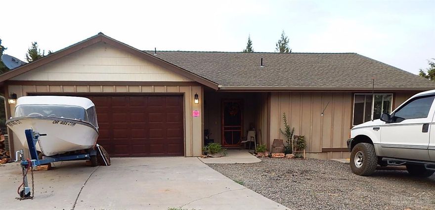 Live the outstanding recreational lifestyle that is Ochoco West. This well maintained home is move in ready. Single level, RV parking, new fencing, woodstove,laminate flooring and heat pump with central air. Lots of storage inside & out, has newer carpet, walk in closet in master bedroom. The kitchen is bright & open with big pantry & breakfast bar. Great room floor plan w/vaulted ceiling. Nice big backyard with garden,cherry, pear and apple trees and chicken coop.Easy access to Bend, Redmond & Madras.