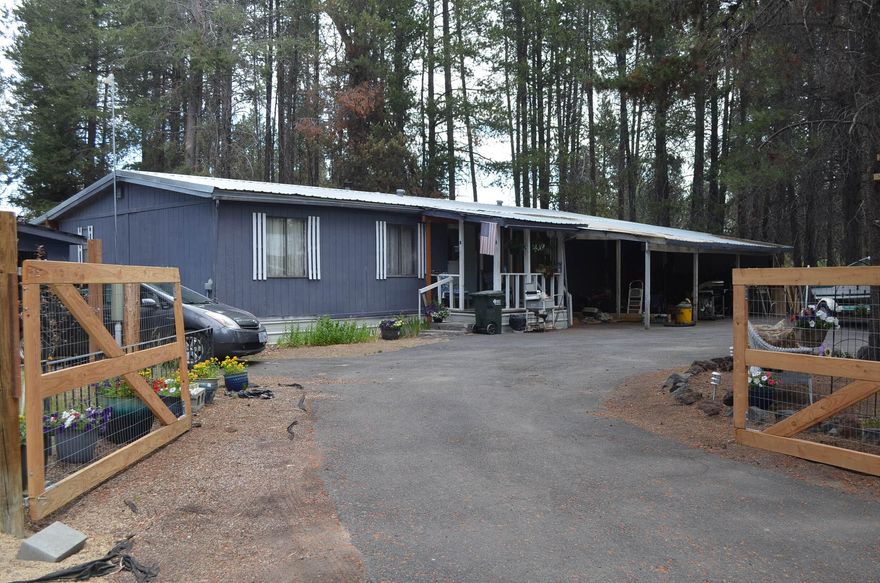 Affordable Country Living - Close to Lakes & Skiing! This 1980 manufactured home sits on just under an acre, offering space, some privacy, and convenience. With 3 bedrooms, 2 full bathrooms, and 1,440 sq. ft., this property has plenty of room to spread out. Features include open floor plan with updates throughout, efficient mini-split heating & cooling system plus cozy wood stove. fenced property with paved, double-gated, U-shaped driveway, and Just minutes from multiple lakes and Willamette Pass Ski Resort. Enjoy the best of mountain living with year-round recreation right at your doorstep. A great opportunity for a primary residence, vacation home, or rental investment!