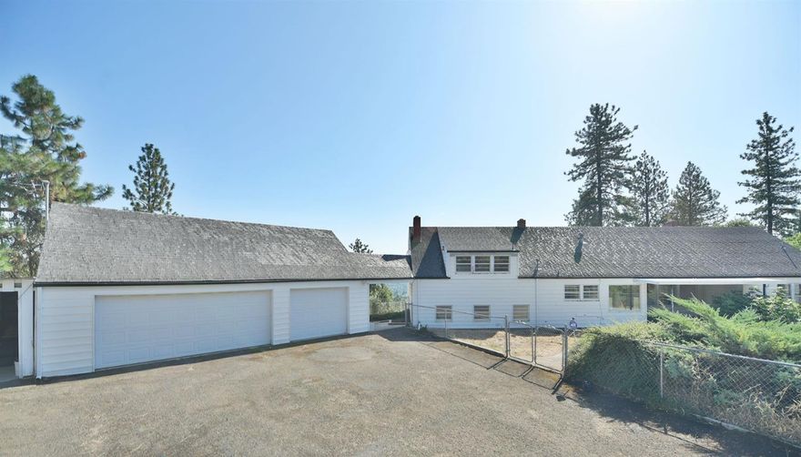 Location, location, location! This classic home sits on 6.12 acres above Old Stage Rd and has amazing views across the valley! The 3635 sq ft home features a beautiful main floor dining area, living room with original fireplace, kitchen, hobby room, bathroom, and master bedroom. Down a few steps is a cozy family room with another fireplace and bathroom with outdoor access. On the top floor, you'll find two additional bedrooms, a full bathroom, and 2 large unique spaces that could be configured into bedrooms or a master suite! The home is set back from the road on the spacious property which features an in-ground pool, covered patio, 3 car garage, and water rights for irrigation. This classic needs TLC and your imagination to turn it back into a magnificent private estate with wonderful valley views! Home priced to reflect seller motivation and renovation costs. Schedule an appointment to see it today!