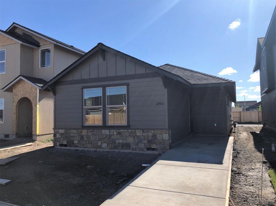 Cottage style home w/great curb appeal! Larch Floorplan. Cozy & efficient, home features a Great room layout w/central kitchen w/huge island for entertaining. Custom cabinetry w/tons of storage, Quartz slab ctrs, full tile back splash, SS Energy Star appliances. Master separation, dbl closets & tray style ceiling. Traditional laundry room too! Laminate floors in main living. Gas forced air, landscaped & fenced w/sprinklers. Alley garage! See model home @ 2985 NW Cedar Ave, Thu-Mon 12-5pm. Will be complete end of summer.