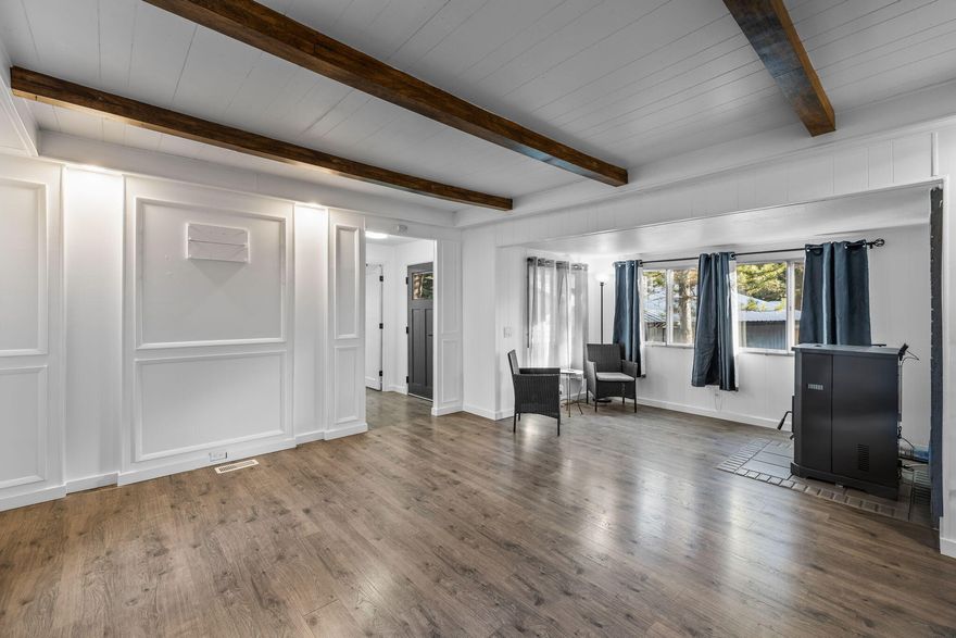 Great opportunity to own your home or investment property in SW Bend! Add an ADU or use as a rental property. Rental income was $26,400 in 2023. This home also shows available on the City maps for Short Term Rental! Nestled among tall pine trees, on a large, .32-acre lot at the end of cul-de-sac. 1008 SF home, 2 bedrooms each with private entry full baths and a den/sitting area. Included is the 700 SF garage/workshop,120 SF potting shed, fully fenced yard, dog run, RV parking with space to add an ADU. Completely updated with new interior paint throughout, new entry front door with keyless entry, interior doors, LVP flooring, roof, electrical plugs and switches, LED ceiling lights, vanity and fixtures. Brand new ENERGY STAR certified refrigerator with built-in ice maker. New pellet stove adds an alternative heating source to the recently serviced HVAC system. The oversized garage/workshop, 25' x 28' includes 220V electrical and 2 garage openers. New front entry TREX decking.