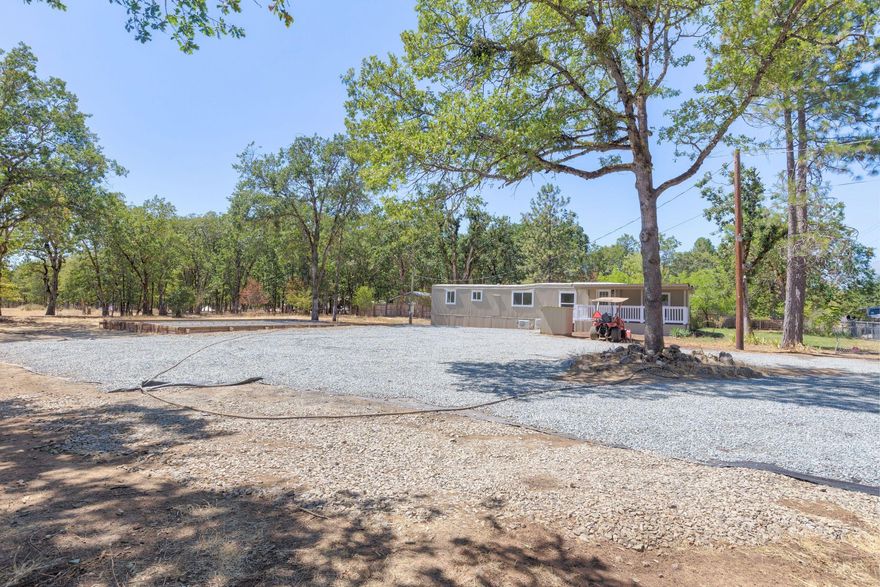 Nice, Remodeled, move in ready, Manufactured home on .55 of an acre.  This newly remodeled home features 3 bedrooms, 2 bathrooms, approx. 1068 sqft, Laminate floors, living room, Kitchen with all new appliances, R/O, DW, Frig and Microwave, new hickory cabinets and new counters.  New ductless units in each room, new windows, new stackable washer & dryer.  New electrical and panel, new plumbing and new well pump. The front has a large, covered deck.  Level, fenced lot with gravel circular driveway.  There are plenty of areas for your toys, garden or to build a garage.