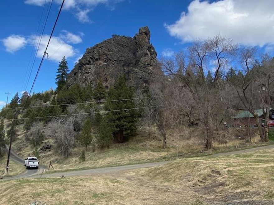 2 Acres Close To Canyon City!  Fabulous views, graveled driveway, cement slab wired for radiant heat, large rock outcropping, shared spring, close to city sewer.  $87,000   #1051