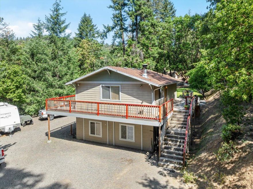 Escape to the tranquility of country living. Charming quaint 2 story home located on 3.24 acres.  Peaceful and quiet with lots of wildlife. Located just above the fog and inversion layer, only 10 minutes to historic Jacksonville or Medford city limits. Home features open kitchen, lots of windows, spacious bathroom with jetted tub. Enjoy the beautiful sunsets from the wrap around decks, terraced backyard, 12 X 12 storage shed/shop, lots of parking. Established trails to BLM. So much potential and possibilities. Motivated Seller, Will look at all offers.