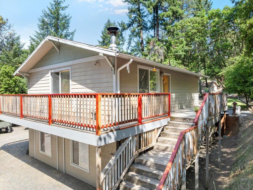 Experience the serenity of country living in this charming two-story home set on 3.24 acres. Peaceful and quiet, with abundant wildlife, it sits just above the fog and inversion layer, only 10 minutes from historic Jacksonville or Medford city limits. The home boasts an open kitchen, plenty of windows, and a spacious bathroom with a jetted tub. Take in stunning sunsets from the wraparound decks, enjoy the terraced backyard, a 12x12 storage shed/shop, and ample parking. Established trails lead to BLM land. Endless potential and possibilities. Motivated seller willing to consider all offers.