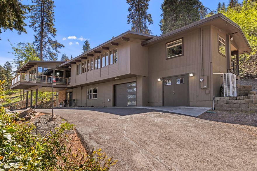 $10,000 seller credit with acceptable offer!! Versatile Upper Klamath Lake retreat on nearly 3 acres with 30' x 38' shop, attached ADU, and pasture. This 2,776 sq ft home offers 4 bedrooms and 3 full bathrooms, with an upgraded kitchen featuring dual ovens, custom cherry cabinetry, and modern appliances. Exposed brick and tongue & groove ceilings combine charm and warmth. Enjoy lake views from the living room and deck or soak in the hot tub after a long day. Ground level features an 816 sq ft accessory dwelling unit with separate entrance, full kitchen, living room, bedroom, and laundry—perfect for guests or short-term rental. The 2021 heated shop includes a car lift, insulation, and overhead RV door. Additional structures include an attached garage, detached 2 car garage, and a barn. About 1.5 acres of pasture make this a rare horse property just minutes from downtown, Sky Lakes, Oregon Tech, and Klamath Commons. Split property offers enhanced privacy. March 2025 appraisal available.