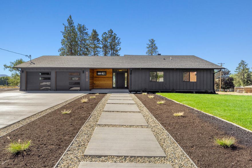 6010 Shasta Way is a stunning contemporary design that has been completely renovated. Over 3500 square feet of living space situated on 1 acre that has large viewing windows in the back of the home which allow for grandiose views from the kitchen, dining, fireplace room and primary bedroom which are looking toward the southern mountains and allowing plenty of solar sunlight into the home. Redesigned vaulted ceiling on the main floor with a custom natural rock gas fireplace with handcrafted white oak mantle. Lower level has ample room around the custom fireplace and has additional space big enough for a pool table or game area poker area. There are 3 bedrooms on the main level and two on the lower level. Primary suite is on the main level. If one acre isn't enough the developer has more one acre lots that could be made available in the future. If you would like a list of the complete details of renovation you can contact the listing agent. Please call to schedule a showing today.