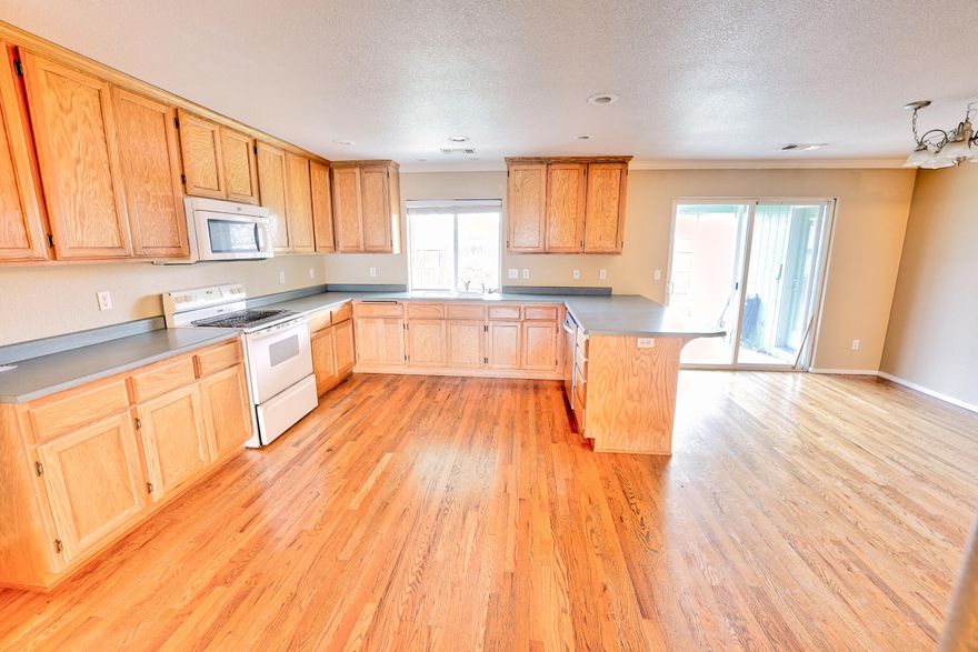 Beautiful Home with lots of custom work.  Great Open Floor plan, huge kitchen, large primary bedroom with  walk-in closet & door that has access to a wonderful covered patio.  Real hardwood flooring with extra wide hallway and entry. Home features vaulted ceilings, gas fireplace, large utility room with sink and tons of storage. Well manicured yard with mature landscaping & inground sprinklers. Small RV Parking / large side yard. Now vacant and Move in ready!