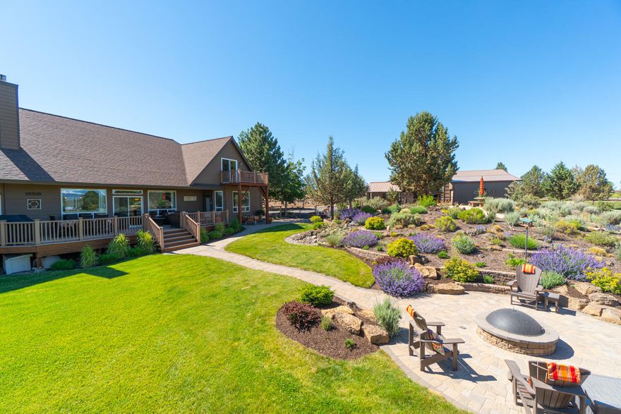 Stunning, sweeping mountain views from Mt. Bachelor to Mt. Hood. Private and peaceful! Just under 10 acres, irrigated, fenced/x-fenced, shelters, multiple barns, potting shed and pond. Gardener's delight with extensive, lavish landscaping and flower beds. Bubbling waterfall feature and built-in propane firepit. , plus expansive decks and patios to enjoy the exquisite views! Gorgeous, updated 3300sf home boasts vaulted ceilings and open, great room style floor plan, perfect for hosting gatherings! Kitchen and Primary Suite have been extensively remodeled and thoughtfully updated with high-end finishes throughout. 3 full bathrooms, 4 bedrooms plus an office, loft and bonus room offer plenty of options for entertaining. Radiant heated flooring in primary bath and kitchen. Make this little slice of heaven yours today! Only a few minutes to downtown Bend, Oregon - one of the most sought after destination cities in the U.S.