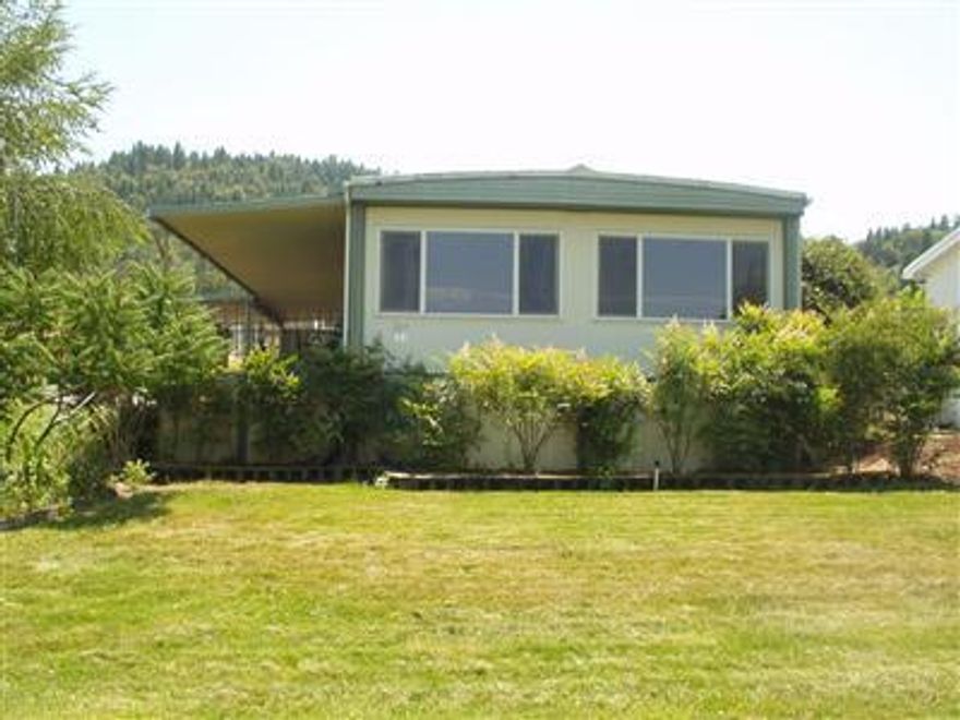 Owners have been updating the home since the 80's.Newer Pergo flooring throughout,except for living room,dual pane,vinyl windows,heat pump,perma seal roof & a newer wall oven & refrigerator.Master bdrm has a large walk-in closet & a large wall closet,built-in dining rm hutch,indoor laundry,water softener.Back porch has been enclosed for use as a hobby room,big storage shed.Two sides of the home are adjacent to the park's open space lawns & the pool table bldg.This is a fabulous place to live.