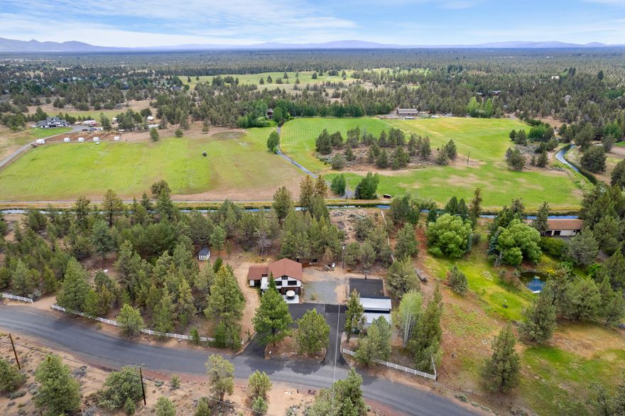 Don't miss out on this remodeled home just 15 minutes from downtown Bend. The location is quiet and peaceful. Home features a nice flowing open floor plan with primary on the main level. Real wood-burning fireplace in the primary bedroom (piped for propane conversion) Laundry connections on both floors. 3 bedrooms upstairs with high ceilings. One bedroom includes access to a balcony. Includes water rights for 2 acres of Swalley irrigation. Home fully remodeled in 2019. The new detached garage was built in 2020 for all your central Oregon toys. Don't miss out on this one!