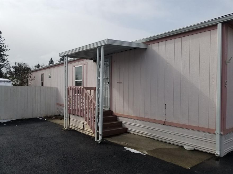 This 1991, 2 bedroom, 1 bath manufactured home really needs to be seen. Vaulted ceilings, vinyl windows, high-end appliances, laminate and vinyl flooring, are all waiting to make this a cozy home. The exterior paint is new, private fenced yard with Hot Tub is an added Bonus. There is lots of room for a garden. One pet is allowed, 20 lbs. and this 55+ park has one of the lowest park rents in the area at $495. This pleasant park is close to everything Grants Pass has to offer.