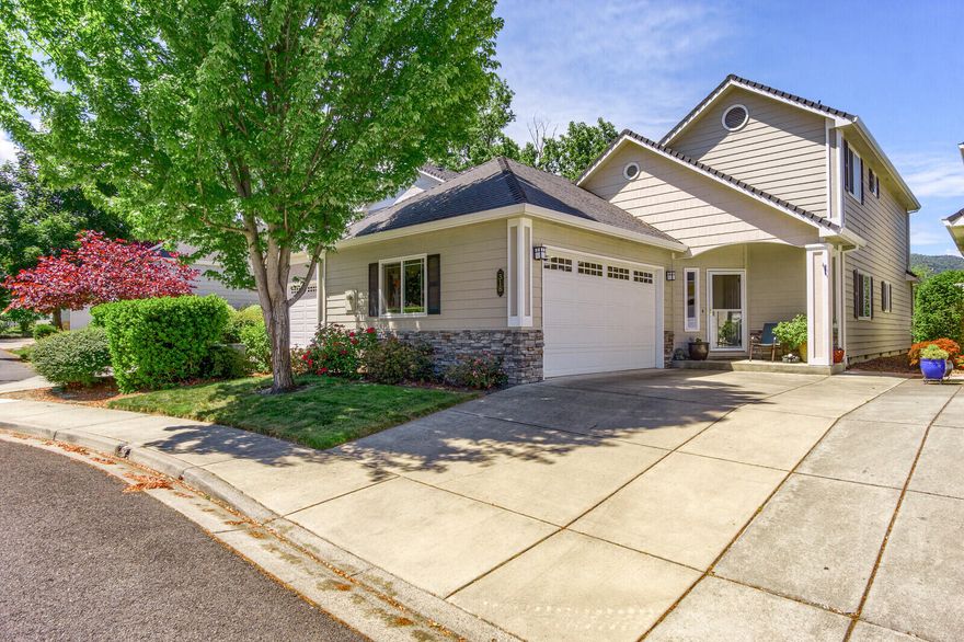 Stunning contemporary home in Meadowbrook Park Estates.  This home provides both privacy and relaxing views of wetlands & pasture land.  The Open floor plan features vaulted ceiling, gas fireplace with mantel, maple cabinets, stainless appliances with gas cooking, on demand hot water, deep stainless sink, eating bar & dining room.  Two spacious bedrooms on the main level with upgraded full walk-in tile shower.  Upstairs to the gorgeous master suite with slate walk-in shower, soaking tub and double sinks.  Floorings are carpet, maple laminate and slate.  Beautiful French doors to the private backyard with water feature, retractable awning, sun shade and raised garden beds.  9' ceilings, ceiling fans, inside laundry & 2 car garage.  This home is close to the private park & creek.  Low monthly HOA covers the landscaping & maintenance. This home is kept in immaculate condition and shows well. DO NOT LET CAT OUT FRONT.