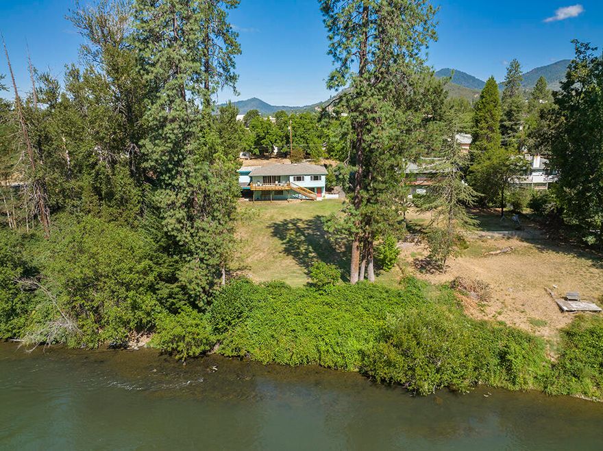 If living on the Rogue River is on your ''wish list,'' then you will want to take a look at this classic 3 bedroom, 3 bath home that enjoys beautiful river views from sunrise to sunset.  Built in 1960, the 2444 square foot home still has that original flavor while boasting home-friendly upgrades.  The downstairs family room has a fireplace, bathroom and kitchenette for a possible separate living space.  Located just upstream from Grants Pass, the half acre property provides plenty of space indoors and out for year-round enjoyment.