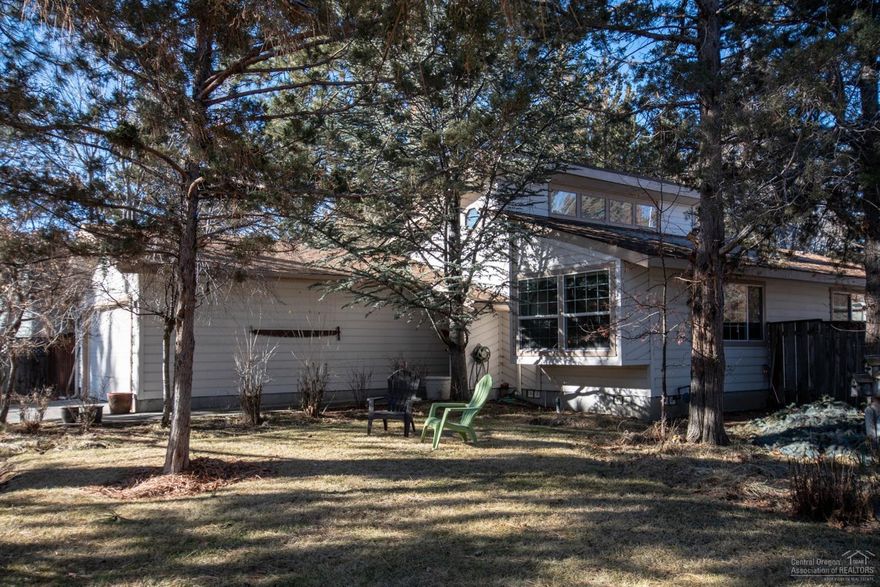 Location! Single level home on a large, lushly mature landscaped lot in Tanglewood. This 1446 Sq Ft home is light and bright with new skylights and vaulted ceilings. New Pergo planking throughout living room, dining, kitchen, and family room. Energy efficient 3 bedroom and 2 bath home with new vinyl windows, high efficiency gas furnace installed in 2012, new woodstove installed in the family room in 2016. Lots of recent upgrades to this comfortable home including Corian countertops in the kitchen, new dishwasher and disposal, new tile in bathroom, and composition roof completed in 2010. Take larkspur trail to access nearby larkspur park or Pilot Butte. Spacious lot with room for a garden and greenhouse in a great neighborhood located right in the heart of beautiful bend.