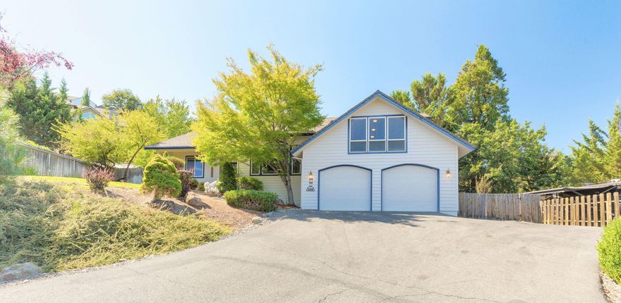 Cool off in the sparkling inground pool or relax by the fireplace in this Northwest Grants Pass home designed with comfort in mind. The open floor plan provides easy flow between the kitchen, dining, and living areas, making it a great space for gatherings. The primary suite is conveniently located on the main level, while a split floor plan gives separation for the additional bedrooms. A bonus room above the garage offers flexibility for hobbies, an office, or guests.
With 2,314 sq. ft., 3 bedrooms, and 2 bathrooms on a .41 acre lot, there's plenty of room inside and out. The landscaped backyard features smart irrigation and a spacious patio for outdoor entertaining. A well-designed property that brings together space, function, and outdoor enjoyment in a desirable part of town.