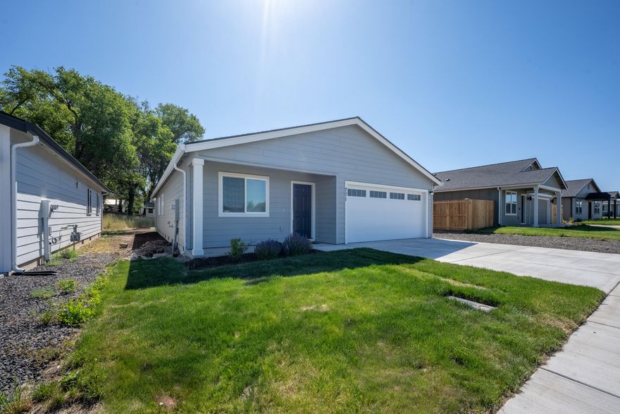 Come and tour this brand-new, move-in-ready home at Sagebrook Estates. 
The single-level, 1527-square-foot home features four bedrooms. 
The open-concept floor plan comfortably combines the kitchen, dining, and family room, making it pleasant for everyday living. The first two bedrooms are off the entry, with the third on the other side. The primary owner's suite is separated from the other bedrooms at the back of the home and features a walk-in closet and en-suite bathroom. 
The Kitchen has quartz countertops, sleek shaker-style cabinets, and stainless steel appliances. Additional features include central air conditioning, a tankless water heater, blinds, a refrigerator, a washer, and a dryer, all included with the purchase. Front and back yards are completed with grass and drip irrigation. There is a bonus flat gravel parking space alongside the concrete front driveway.