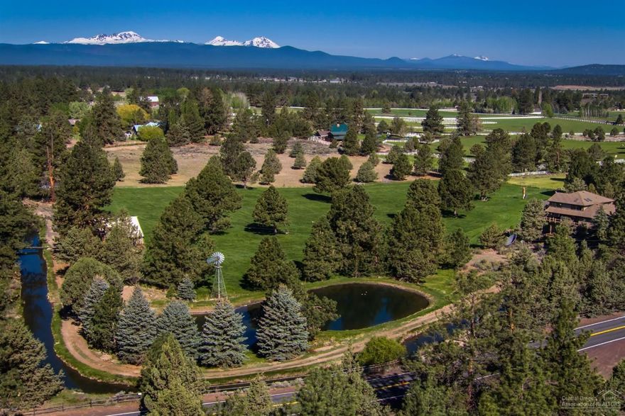 Cascade Mountain Views from beautiful acreage property in Bend. Custom Home is 5005 sf, 4 bedrooms, 2.5 bathrooms, updated kitchen, office, living, family, formal dining, bonus rooms, decks offer wonderful outdoor living overlooking large koi pond, 3 car garage, lots of storage in home. Property is 19.09 acres with 8.8 acres of irrigation water rights, 2 ponds, landscaped, pine trees, meandering canal, paved driveway, shop with concrete floors, barn & close national forest.