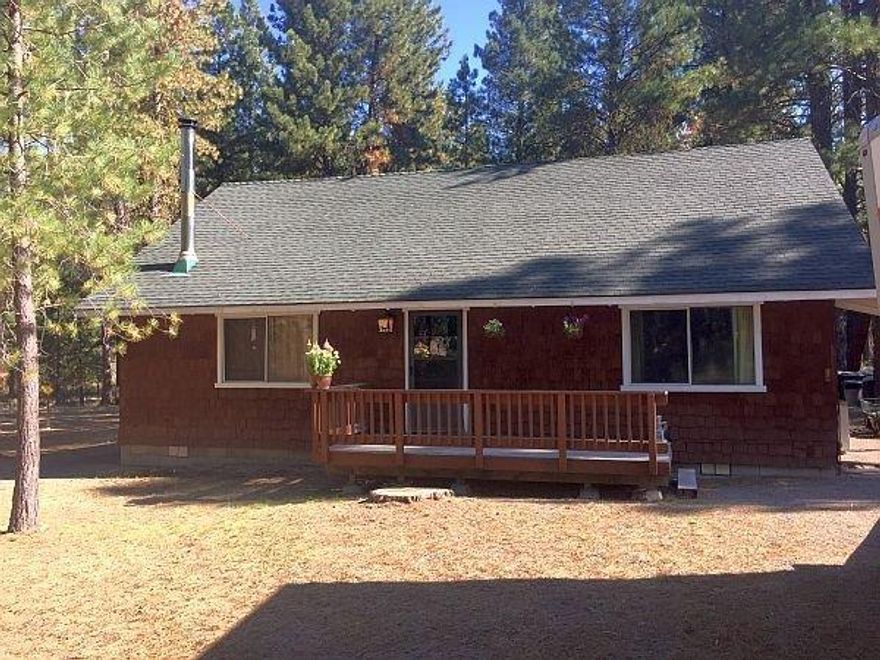 Private and secluded 3 bedroom house on 1 acre. Custom knotty pine cabinets in kitchen. 2 bedroom downstairs w/ large master upstairs. Ceiling fans in every room. Lots of storage throughout home. Certified wood stove for those cold winter nights. Nice little walk down the street to 2 deeded access lots to Williamson River (per seller). Very peaceful!