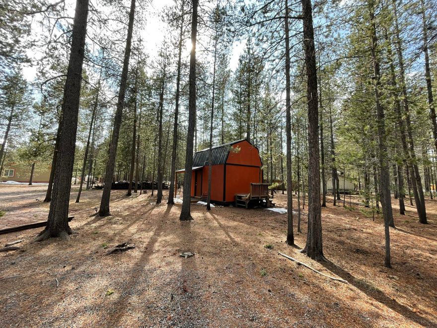 Beautifully manicured 1.05-acre parcel that's fully fenced and gated for privacy. This level, buildable lot sits among mature pines with natural landscaping and a quiet setting. A private well and on-site electricity support future development, with two storage sheds for equipment and generous space for RVs, boats, or a future shop. Minutes from downtown La Pine and close to La Pine State Park, the Deschutes River corridor, and Deschutes National Forest. Convenient access to recreation areas leading toward the Cascade Lakes, offering year-round opportunities for hiking, boating, fishing, and winter sports. Loan option available with 10% down, call for details.